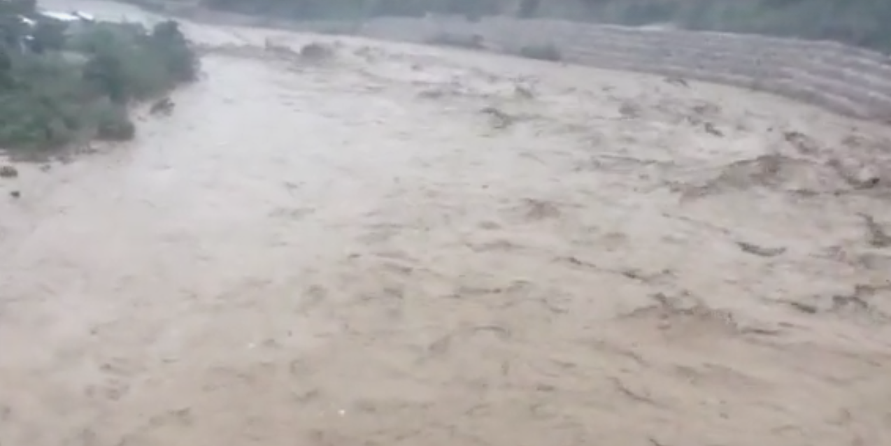 Still from video of river in Haiti flooding in Hurricane Matthew